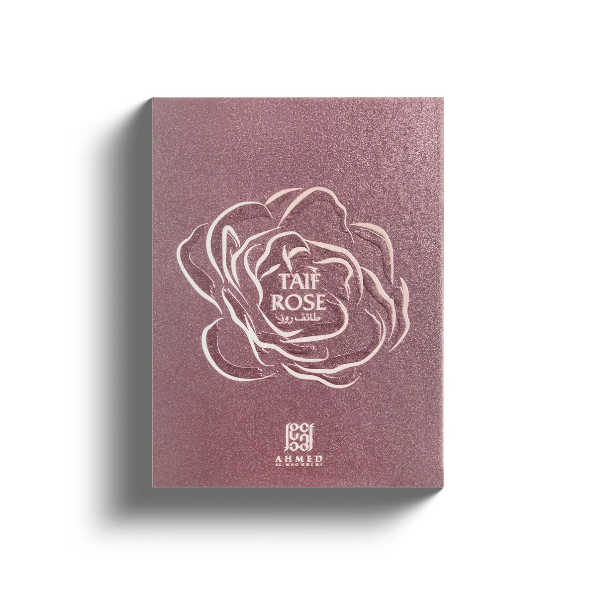 Shimmering mauve perfume box featuring an embossed white rose outline and Taif Rose branding in elegant typography.